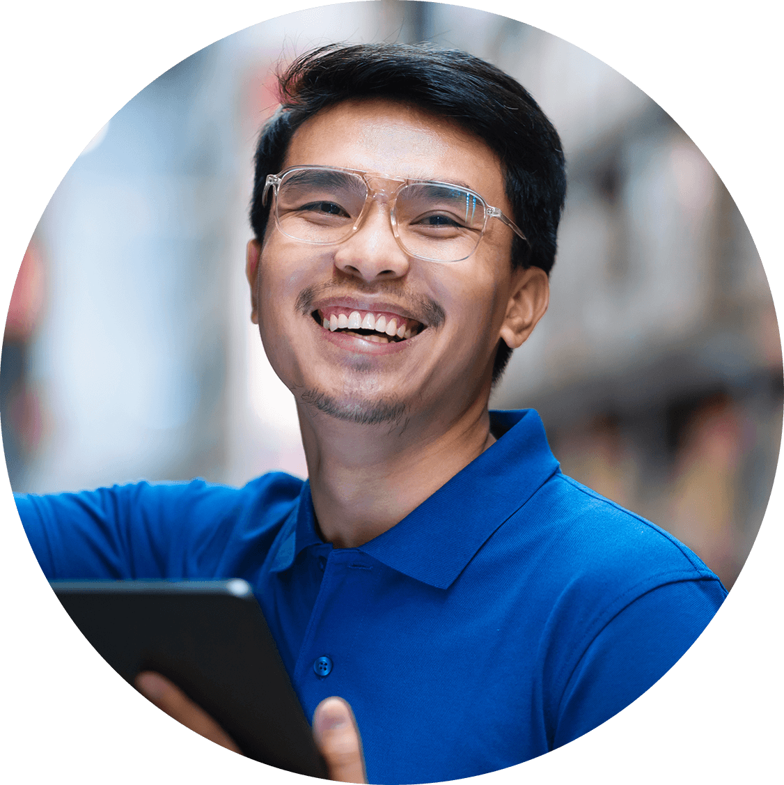 Portrait of cheerful Cambodian man in the warehouse